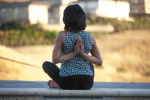 Yoga - Reverse Namaste with grounded Sits Bone